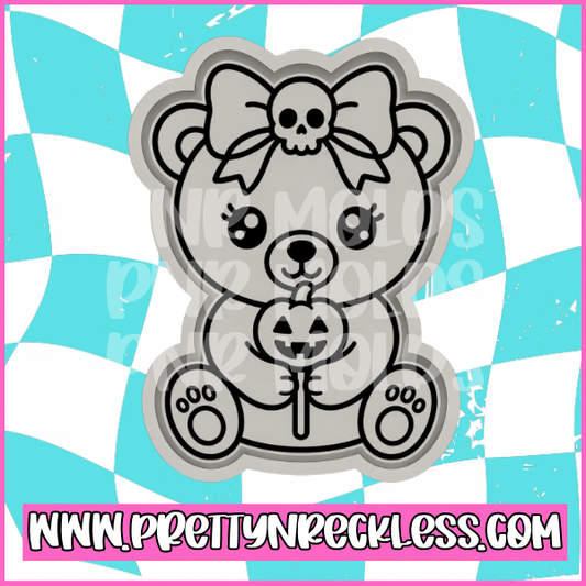Bear with pumpkin lollipop