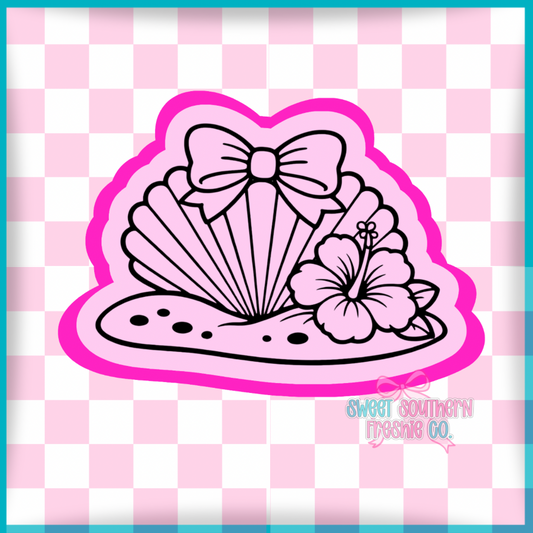 Seashell with sand bow and hibiscus